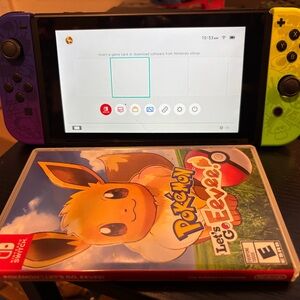Nintendo Switch with Purple and Yellow Joy-Con Controllers
